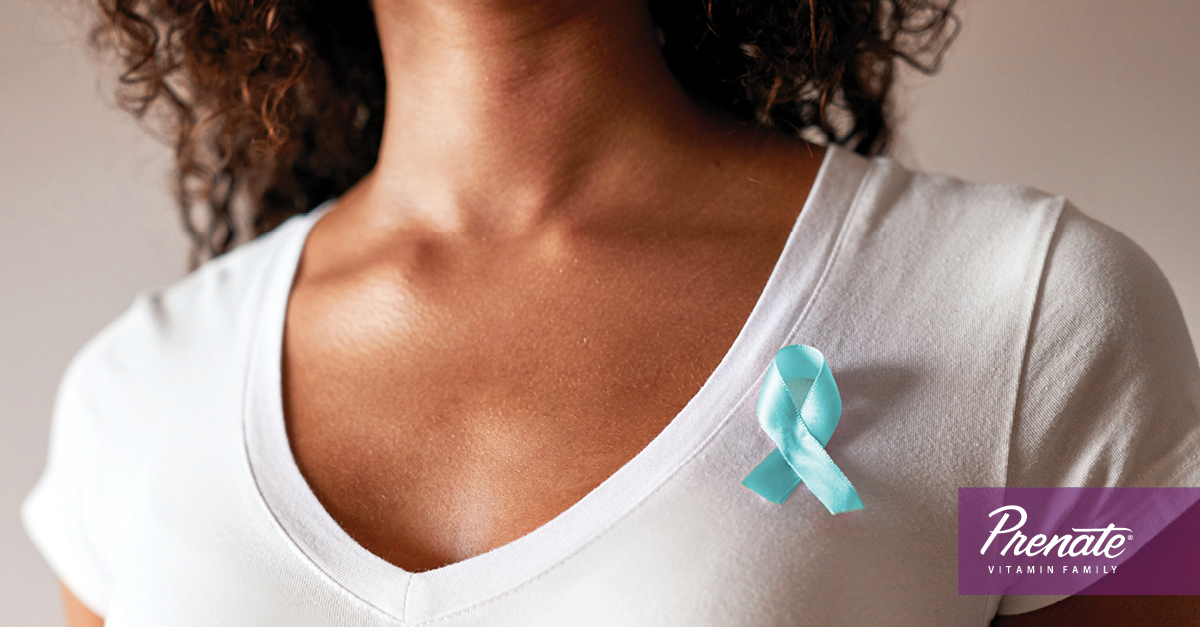 Woman wearing ovarian cancer pin