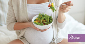 Pregnant woman eating a salad