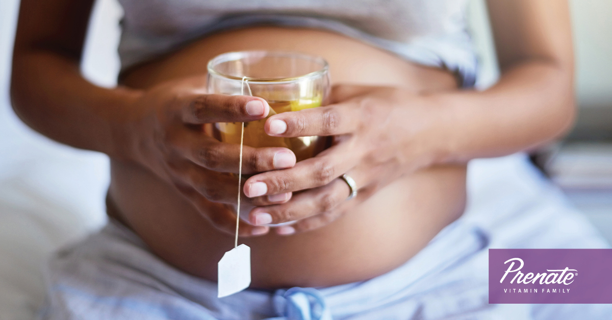 Pregnant woman holding tea