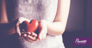 Woman holding plastic heart
