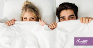 Couple under bed sheets