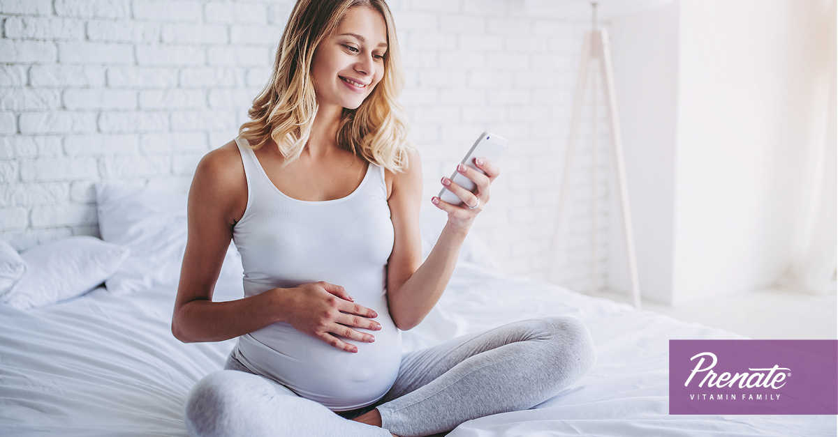 Pregnant woman on her phone